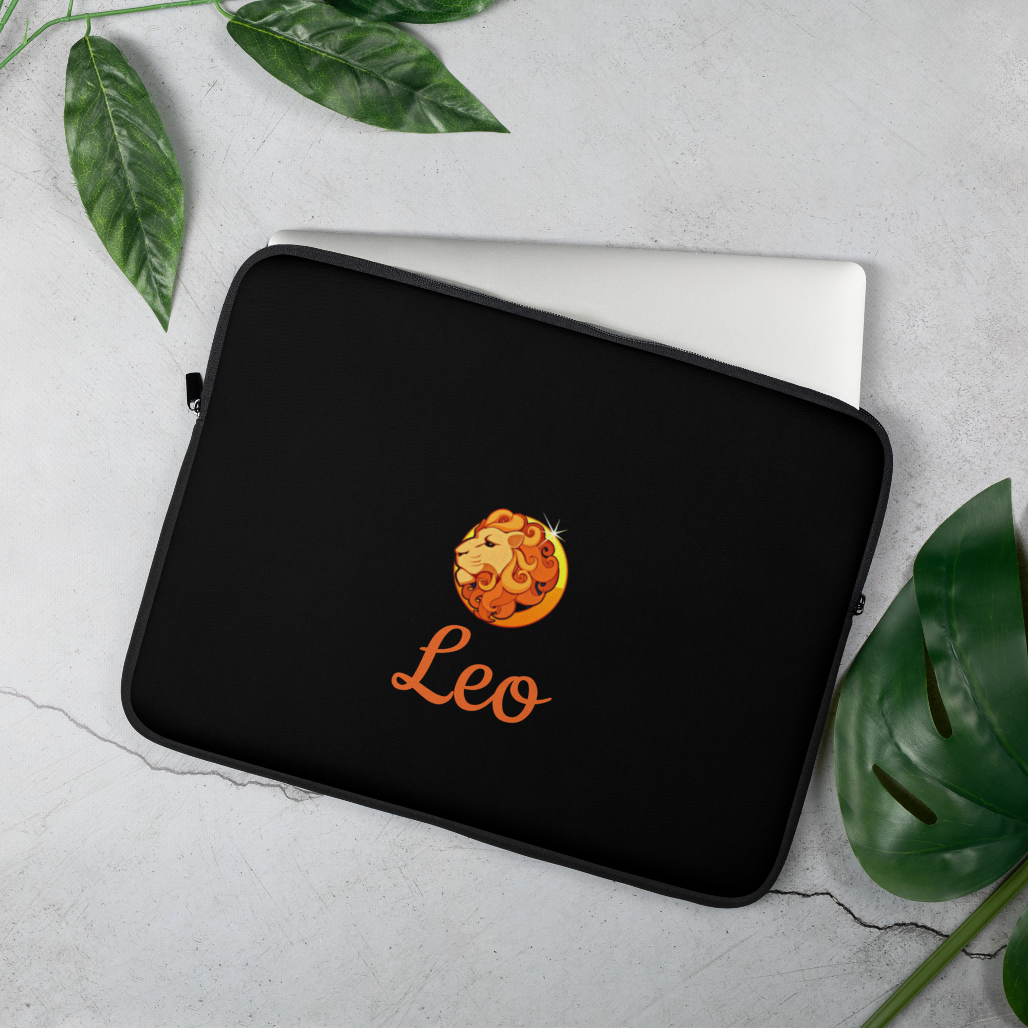 Black laptop sleeve measuring 15" with "Leo" written in orange and an orange/gold/yellow lion illustration